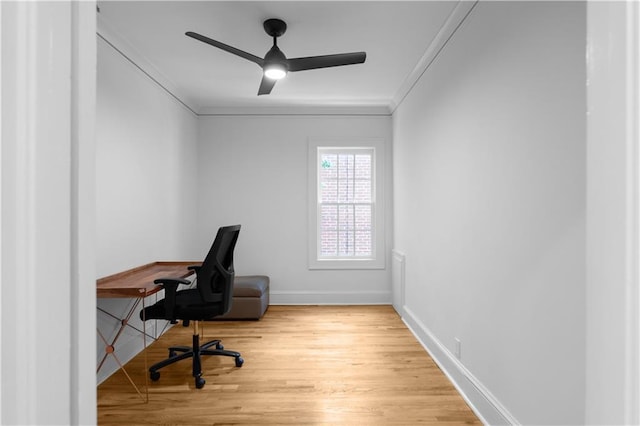 office featuring crown molding, ceiling fan, wood finished floors, and baseboards
