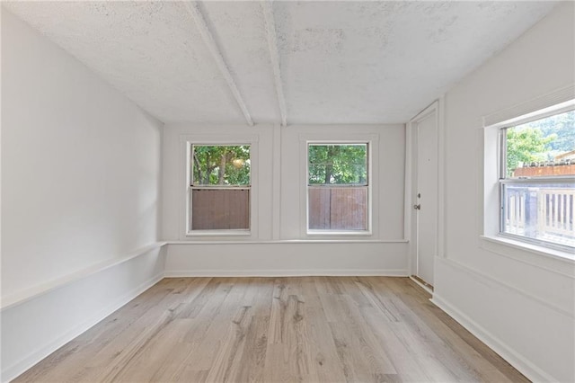935 Bobcat Ct SE, Marietta, GA 30067 - unfurnished room featuring light wood-type flooring and plenty of natural light