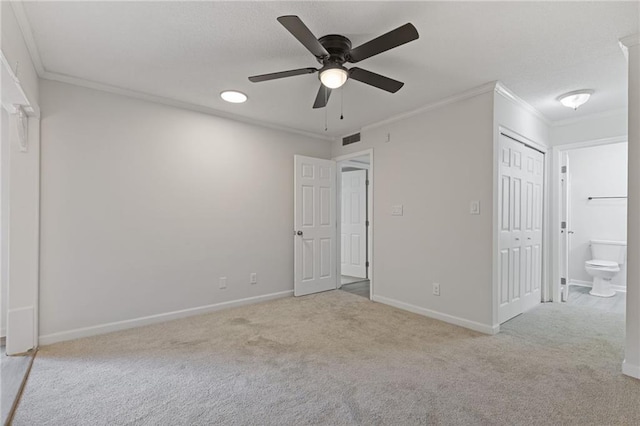935 Bobcat Ct SE, Marietta, GA 30067 - unfurnished bedroom with crown molding, carpet, ensuite bath, a ceiling fan, and a closet