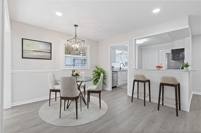 935 Bobcat Ct SE, Marietta, GA 30067 - dining space featuring a chandelier, light wood finished floors, and recessed lighting