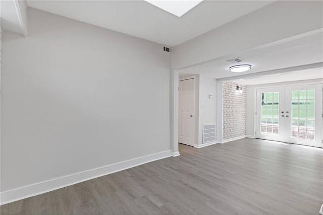 935 Bobcat Ct SE, Marietta, GA 30067 - unfurnished room with french doors and wood finished floors