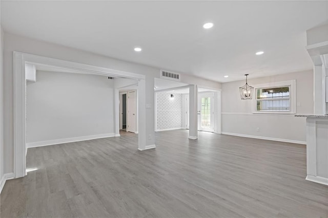 935 Bobcat Ct SE, Marietta, GA 30067 - unfurnished living room featuring a chandelier, wood finished floors, and recessed lighting