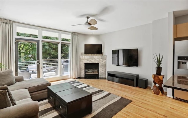 1323 Peachtree Vw NE, Atlanta, GA 30319 - living area featuring a ceiling fan, wood finished floors, a fireplace, and baseboards