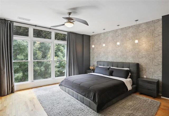 1323 Peachtree Vw NE, Atlanta, GA 30319 - bedroom with wood finished floors and a ceiling fan