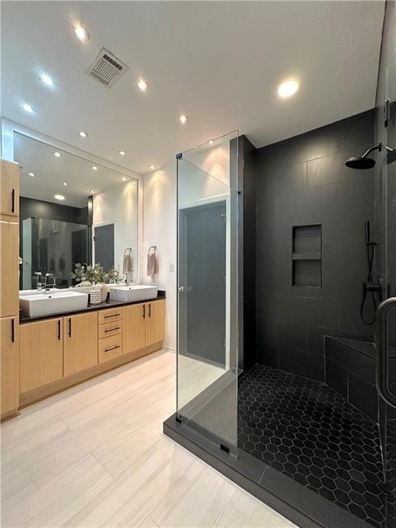 1323 Peachtree Vw NE, Atlanta, GA 30319 - bathroom featuring a walk in shower, double vanity, and recessed lighting