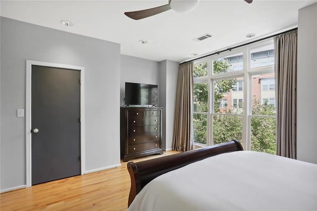 1323 Peachtree Vw NE, Atlanta, GA 30319 - bedroom featuring light wood-type flooring, baseboards, and a ceiling fan