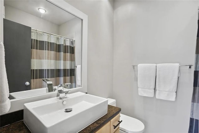 1323 Peachtree Vw NE, Atlanta, GA 30319 - bathroom featuring toilet, vanity, and a shower with shower curtain