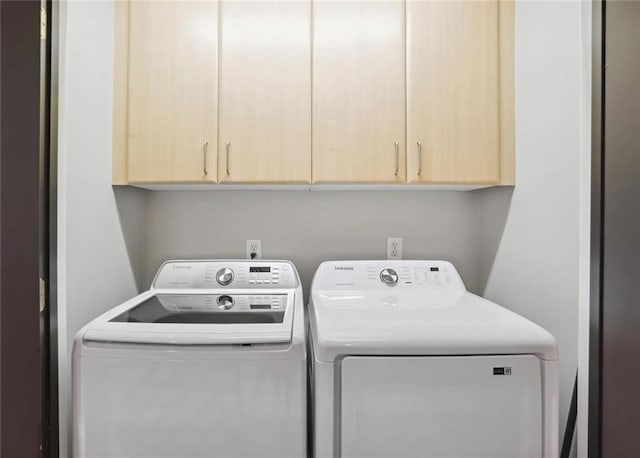 1323 Peachtree Vw NE, Atlanta, GA 30319 - laundry area featuring washing machine and dryer and cabinet space