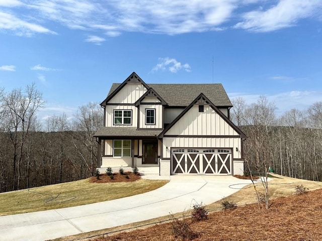 modern farmhouse style home with a front lawn, board and batten siding, roof with shingles, concrete driveway, and a garage