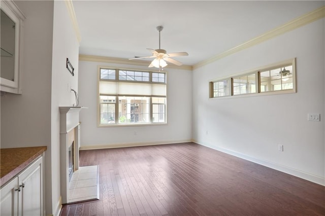 1585 Oak Meadows Ln, Cumming, GA 30041 - unfurnished living room with ceiling fan, ornamental molding, dark wood-style flooring, and a fireplace