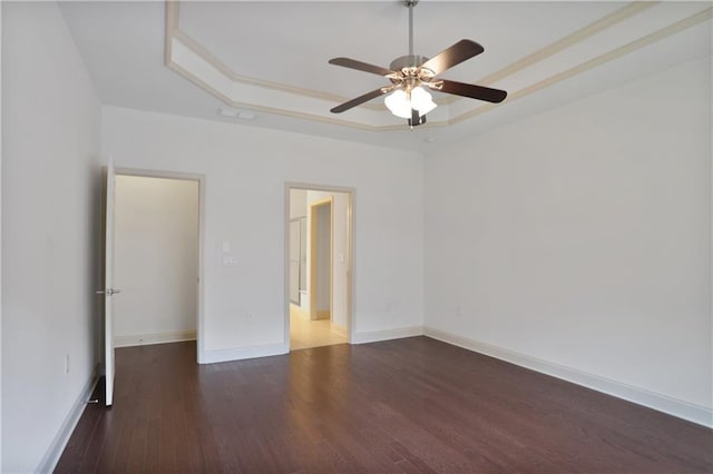1585 Oak Meadows Ln, Cumming, GA 30041 - spare room with a tray ceiling, a ceiling fan, and wood finished floors