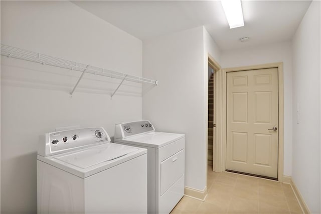1585 Oak Meadows Ln, Cumming, GA 30041 - washroom with separate washer and dryer and light tile patterned floors