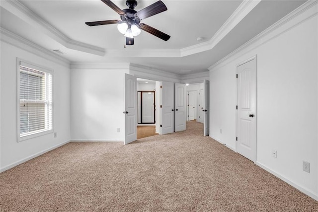 7601 Watson Cir, Locust Grove, GA 30248 - unfurnished bedroom with carpet floors, crown molding, a raised ceiling, and baseboards