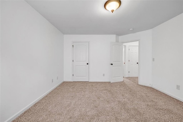 7601 Watson Cir, Locust Grove, GA 30248 - unfurnished bedroom with light colored carpet and baseboards