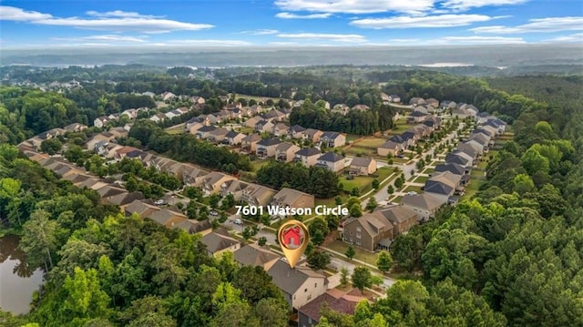 7601 Watson Cir, Locust Grove, GA 30248 - aerial view of property's location with nearby suburban area and a heavily wooded area