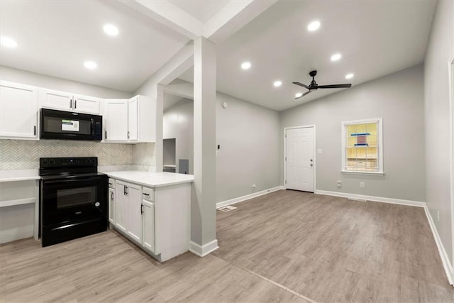 kitchen featuring lofted ceiling, white cabinetry, black appliances, and backsplash