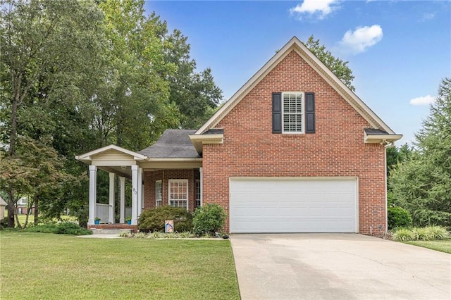 traditional-style house featuring a front yard, a porch, concrete driveway, and brick siding