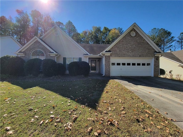 983 Noble Oak Ct, Lawrenceville, GA 30046 - ranch-style home with driveway, a garage, brick siding, and a front yard