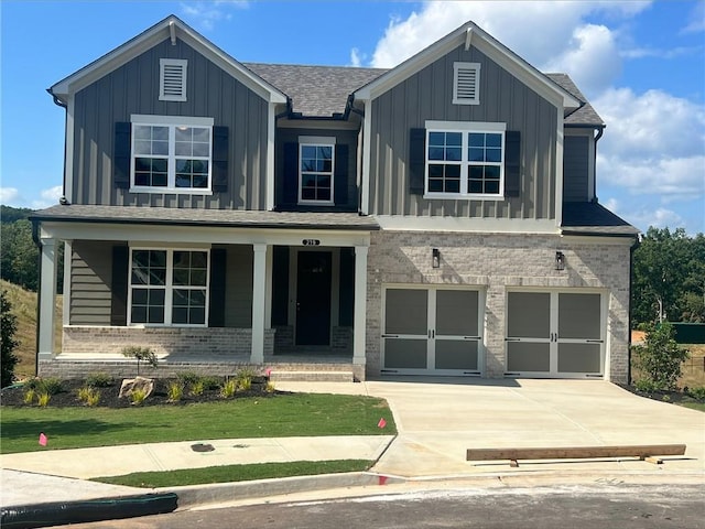 view of front of property featuring a garage and covered porch