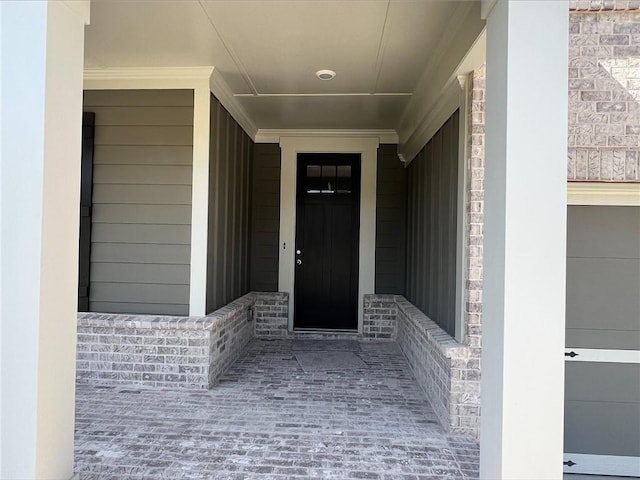 entrance to property with a porch