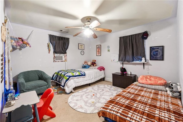 bedroom with ceiling fan, carpet floors, cooling unit, and visible vents