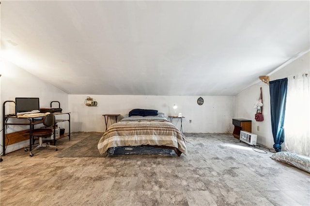 bedroom featuring lofted ceiling