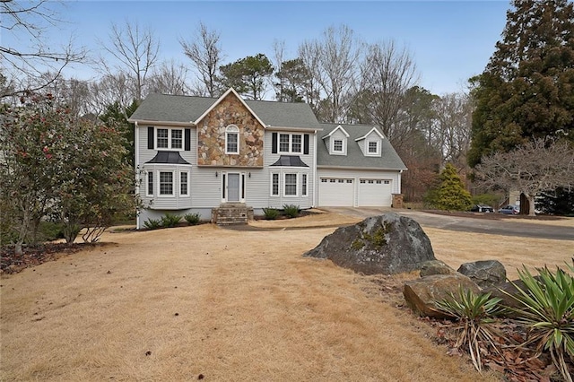 view of front of property with a garage