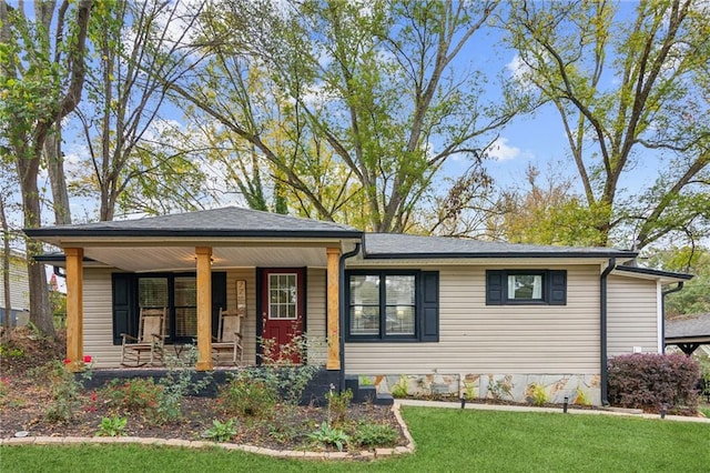 view of front of home with a front lawn and a porch