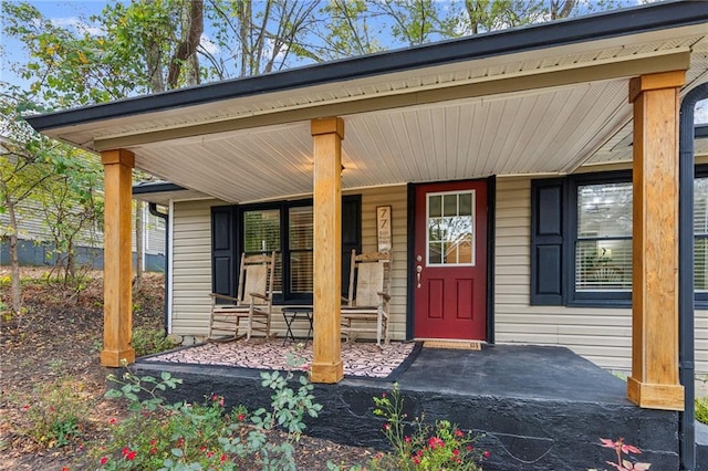 doorway to property with covered porch