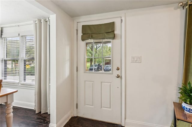 doorway with dark wood-type flooring