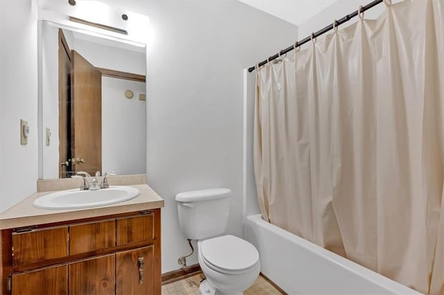 full bath featuring shower / bathtub combination with curtain, toilet, and vanity