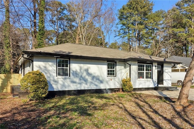 rear view of house with a lawn