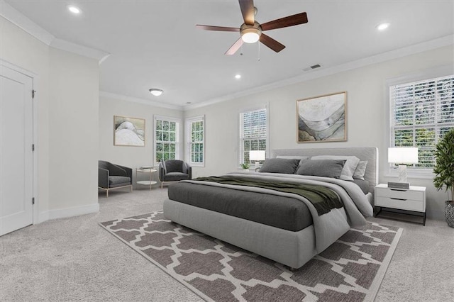 carpeted bedroom featuring visible vents, baseboards, recessed lighting, ceiling fan, and crown molding