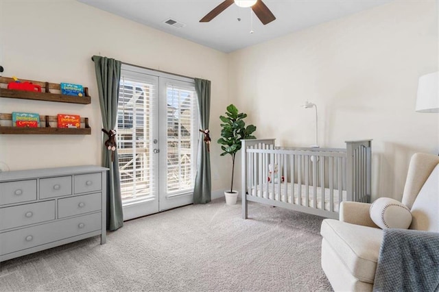 carpeted bedroom with access to outside, multiple windows, french doors, and visible vents