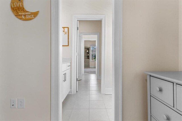 hallway with light tile patterned flooring