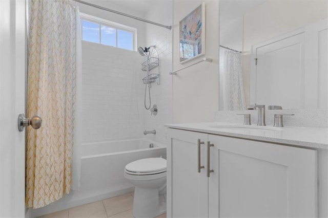 bathroom featuring tile patterned floors, shower / tub combo, toilet, and vanity