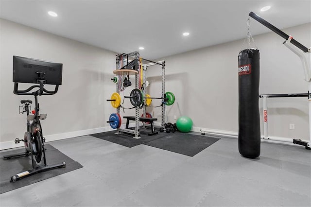 workout area featuring recessed lighting and baseboards