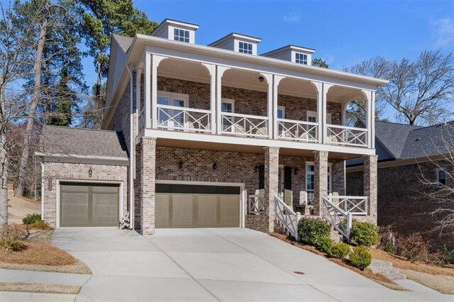 view of front of property featuring brick siding, a porch, and a balcony