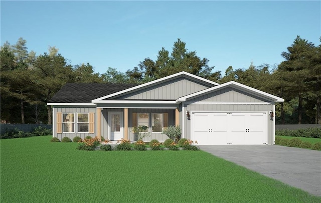 view of front of property with a front yard, a garage, and a porch