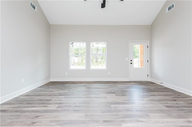 121 Hunters Ln, Powder Springs, GA 30127 - unfurnished living room featuring visible vents, baseboards, a ceiling fan, and wood finished floors