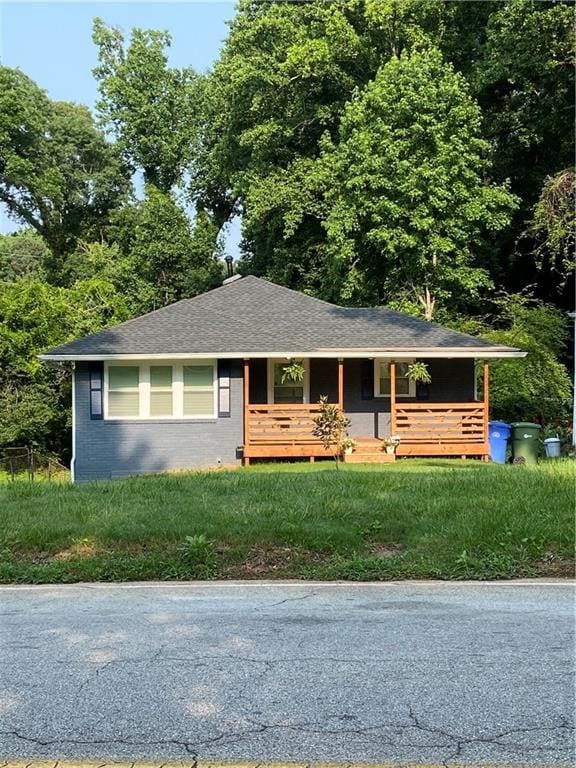 2319 Beecher Rd SW, Atlanta, GA 30311 - single story home featuring a porch, brick siding, and roof with shingles