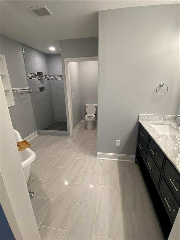 2319 Beecher Rd SW, Atlanta, GA 30311 - bathroom featuring toilet, vanity, walk in shower, and baseboards