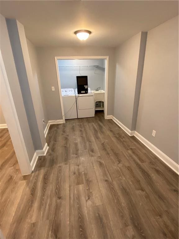 2319 Beecher Rd SW, Atlanta, GA 30311 - hallway with washer and dryer, dark wood finished floors, and baseboards