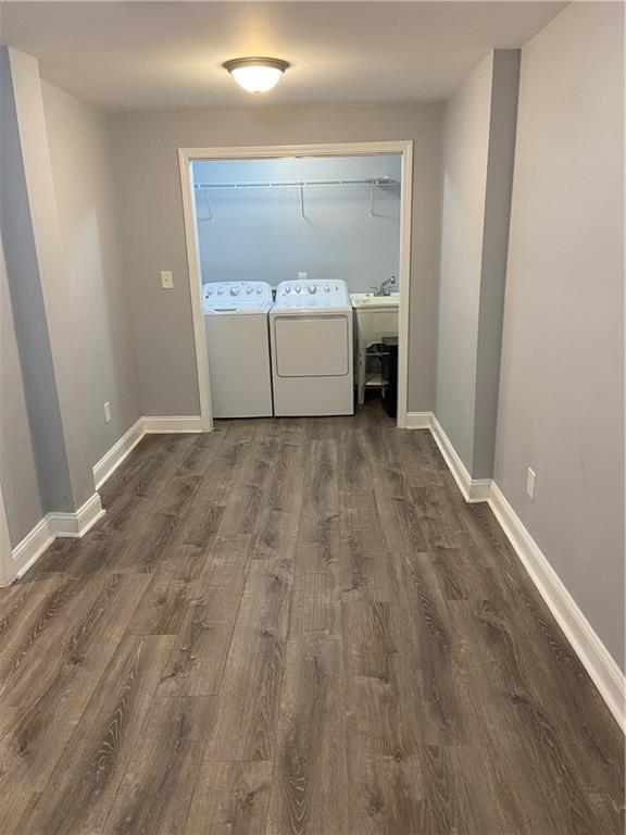 2319 Beecher Rd SW, Atlanta, GA 30311 - washroom featuring washer and dryer, wood finished floors, and baseboards