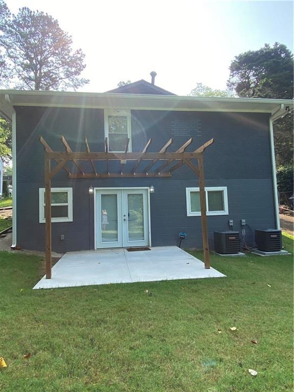 2319 Beecher Rd SW, Atlanta, GA 30311 - rear view of property with a pergola, a patio, central air condition unit, and a yard
