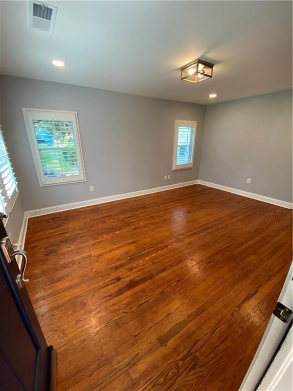 2319 Beecher Rd SW, Atlanta, GA 30311 - spare room featuring dark wood-style flooring, baseboards, and recessed lighting