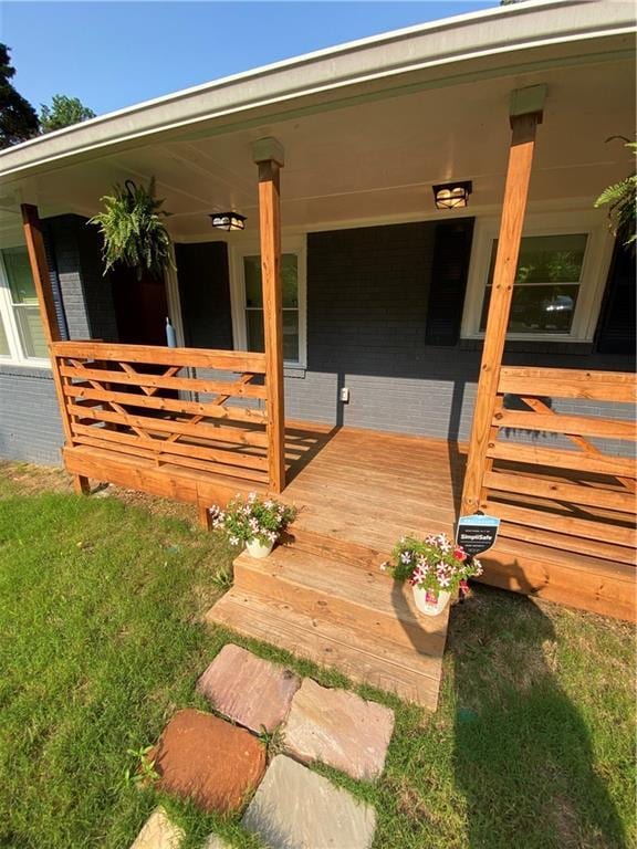 2319 Beecher Rd SW, Atlanta, GA 30311 - view of exterior entry with a porch and brick siding