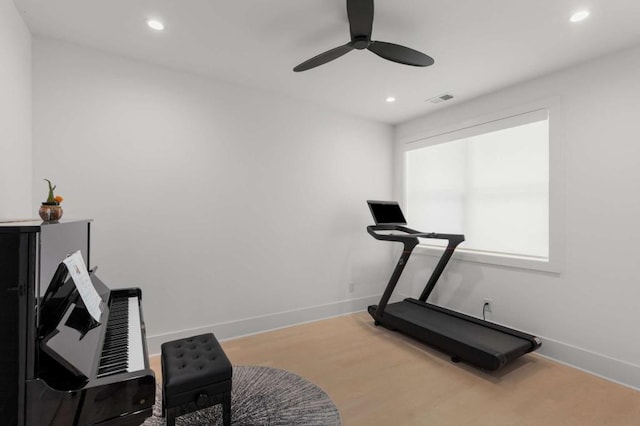 exercise area with ceiling fan, recessed lighting, and baseboards