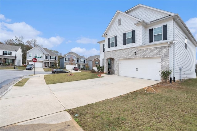 view of front of property with a garage and a front lawn