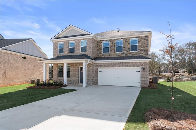 209 Chiswick Loop, Stockbridge, GA 30281 - view of front facade with driveway, a front lawn, a garage, and brick siding